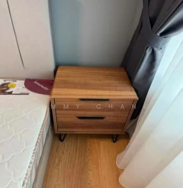 Room features: wooden nightstand with two drawers, light wood finish, metal legs, queen-size bed, white mattress, grey curtains, sheer window treatment, laminate flooring; style: modern.