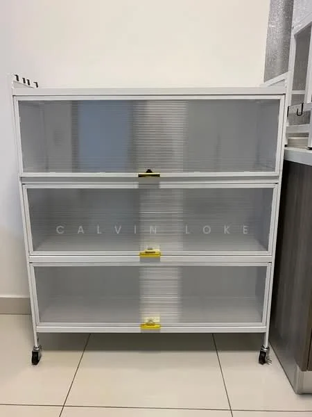 Room features: white shelving unit, four transparent drawers, metal frame, casters for mobility, smooth surface, modern design, minimalist style, neutral color scheme; style: modern.
