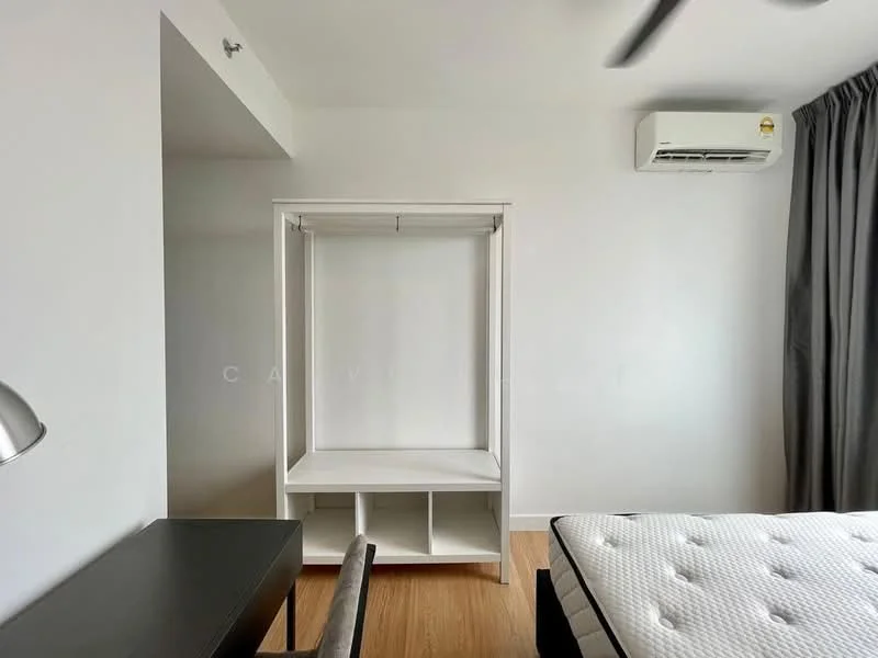 Bedroom features: white painted walls, wooden flooring, 1 wall-mounted split AC, ceiling fan, built-in wardrobe without doors, desk, mattress on bed frame; style: modern.