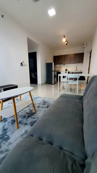 Living features: grey fabric sofa, coffee table with white top and wooden legs, area rug with geometric pattern, recessed LED downlights, wall-mounted TV, open-plan layout to kitchen, sliding glass door, floor-to-ceiling windows, polished tile flooring, neutral painted walls; style: modern. Kitchen features: stainless-steel fridge, built-in oven, freestanding range oven, white cabinetry, black countertops, single-bowl stainless-steel sink, chrome pull-down faucet, tile backsplash, open shelving; style: modern.