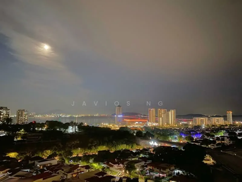 Exterior type: high-rise condominium; features: city skyline view, nighttime lighting, waterfront, surrounding greenery, multiple high-rise buildings, urban landscape; style: modern.