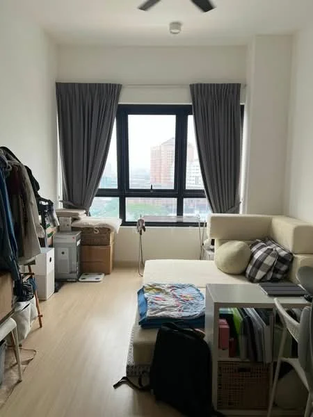 Living features: light wood flooring, white painted walls, floor-to-ceiling windows, grey curtains, sofa with cushions, coffee table, storage boxes, clothing rack, decorative throw blanket, wall-mounted fan; style: modern; view: city.
