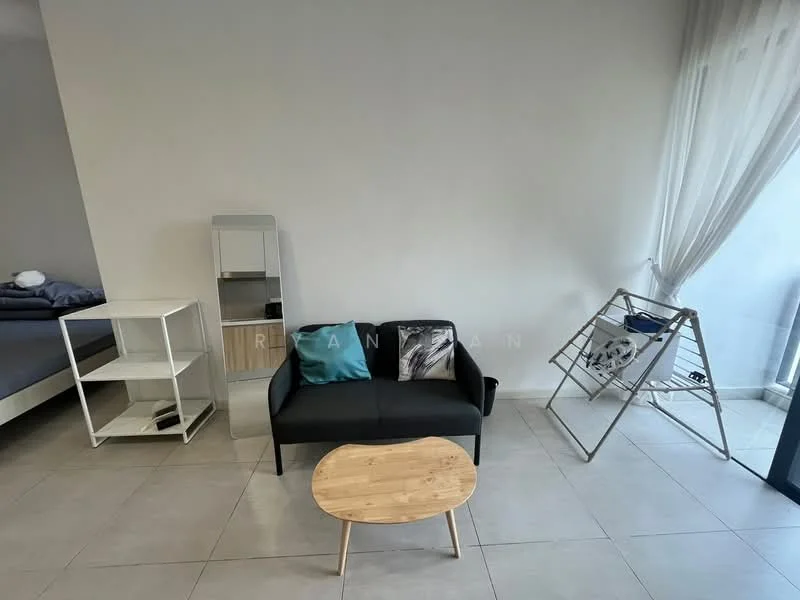Living features: black fabric sofa, wooden coffee table, white open shelving unit, grey bedding on bed in background, folding drying rack, large window with sheer curtains, light grey tiled flooring, white painted walls; style: modern.