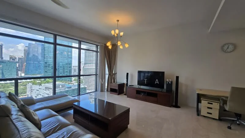 Living features: large floor-to-ceiling windows, city skyline view, cream painted walls, marble flooring, 3-seater leather sofa in beige, coffee table, TV console, wall-mounted TV, chandelier, desk with chair, decorative wall clock; style: modern; view: city.