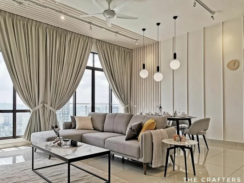 Living features: 3-seater fabric sofa in light grey, decorative throw pillows, coffee table with black metal frame and white top, side table with decorative items, pendant lighting with round white globes, 5-blade ceiling fan, floor-to-ceiling windows, sheer curtains, wall clock, dining table set for four, ceramic dining chairs, light-colored tiled flooring, decorative wall paneling; style: modern; view: city.