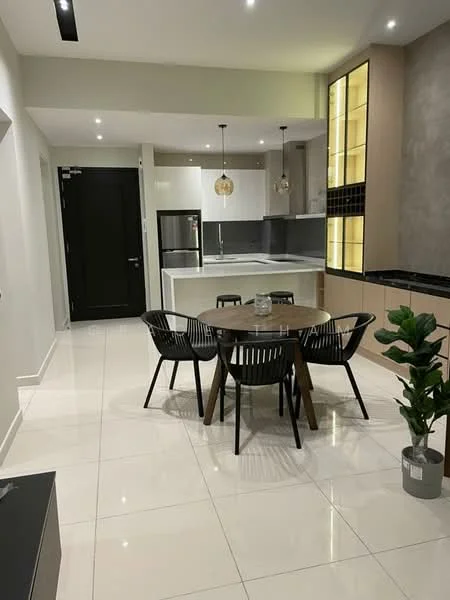 Dining features: round wooden dining table, 4 black woven dining chairs, white tiled flooring, recessed downlights, pendant lighting above table, black cabinetry, grey accent wall, kitchen area visible in background, stainless-steel fridge, open layout, decorative plant in pot; style: modern. Kitchen features: white cabinetry, black countertop, stainless-steel appliances, built-in oven, induction cooktop, grey backsplash; style: modern.