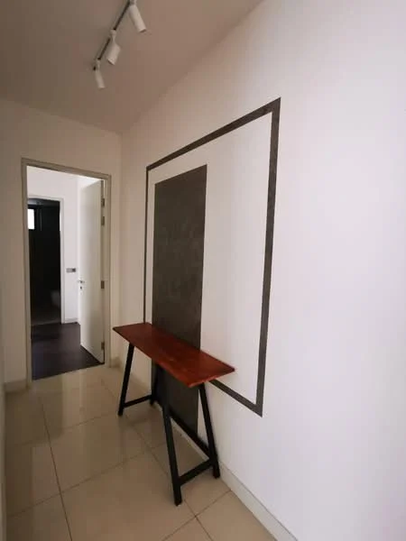 Hallway features: white painted walls, tile flooring, wooden console table, track lighting, grey accent wall, doorway leading to another room; style: modern.