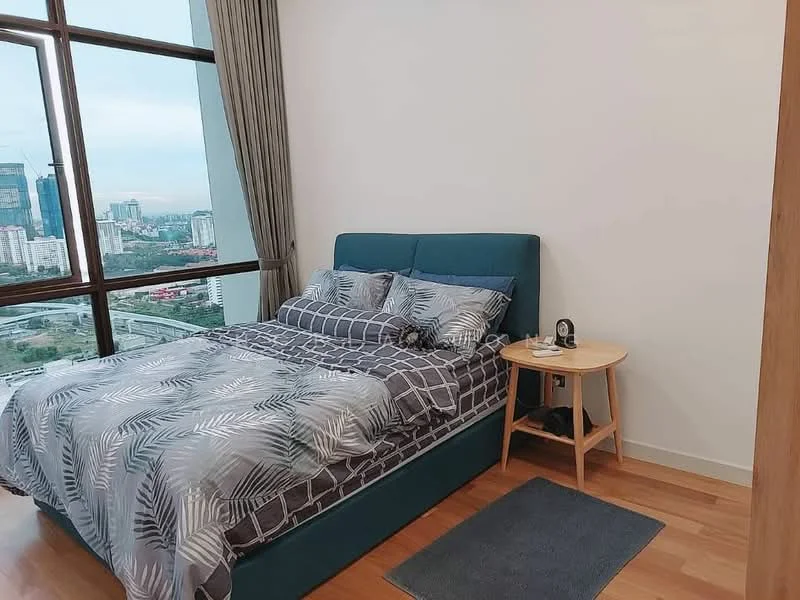 Bedroom features: king-size bed with upholstered headboard, bedding with leaf pattern, nightstand with lamp, wooden flooring, floor-to-ceiling windows, curtains, city skyline view, area rug; style: modern; view: city.
