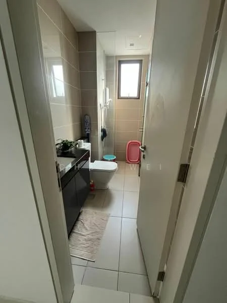 Bathroom features: white toilet, single-sink vanity with dark wood cabinet, mirror above vanity, shower with glass enclosure, tile flooring, light beige wall tiles, window for natural light, bath mat, pink trash bin; style: modern.