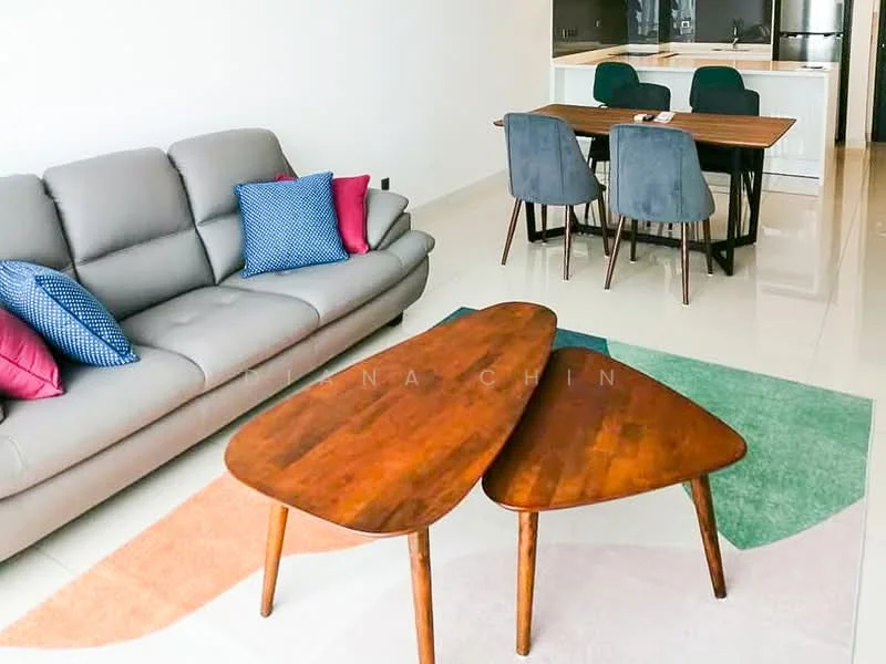 Living features: 3-seater fabric sofa in grey, decorative cushions in blue and pink, wooden coffee table with two-tier design, area rug with geometric pattern, dining table with 6 chairs, open kitchen visible in background, white walls, glossy tile flooring, recessed downlights; style: modern.