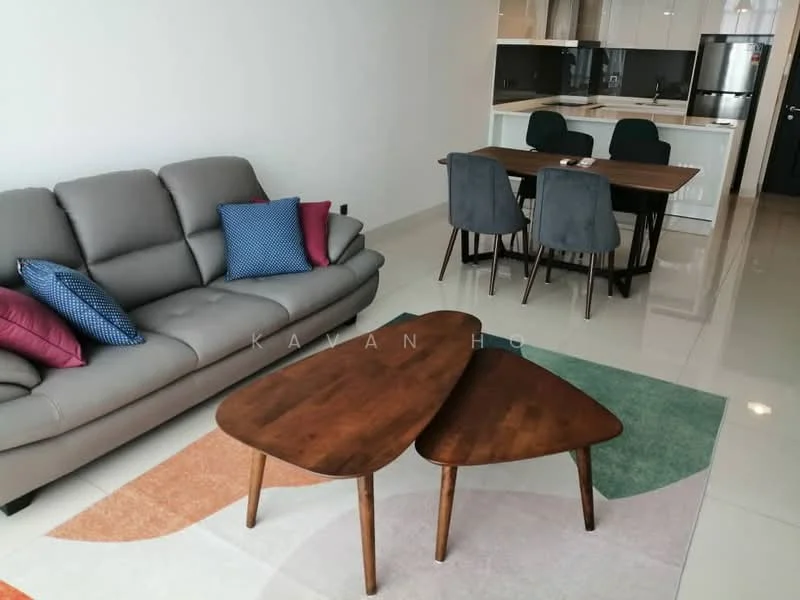 Living features: 3-seater fabric sofa in grey, decorative cushions in blue and pink, wooden coffee table with unique shape, area rug with geometric pattern, wall-mounted TV, dining table with 4 upholstered chairs, open-plan layout to kitchen, glossy tiled flooring, neutral painted walls, recessed downlights; style: modern. Dining features: dining table with wooden surface, 4 upholstered dining chairs in grey, open kitchen area, kitchen cabinetry visible in background; style: modern.