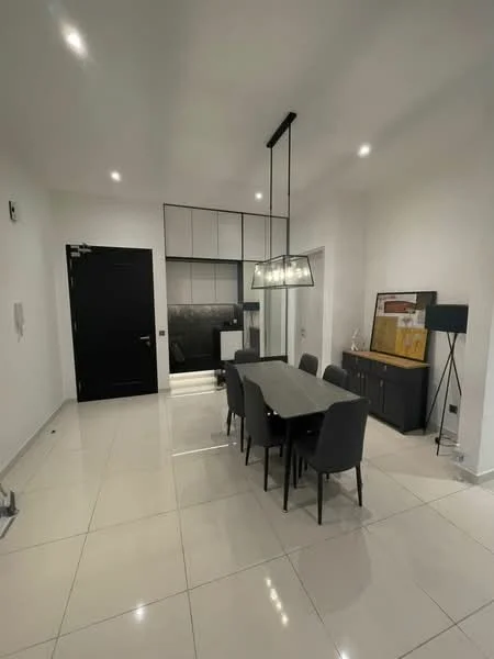 Dining features: rectangular dining table, 6 upholstered dining chairs in grey, pendant light fixture above table, white painted walls, glossy tile flooring, black cabinetry, black backsplash, built-in kitchen appliances visible, floor-to-ceiling windows, recessed ceiling lights; style: modern.