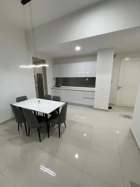 Dining features: white painted walls, glossy tile flooring, 6-seater dining table, upholstered dining chairs in grey, pendant light fixture, built-in cabinetry, stainless-steel fridge visible in background, kitchen countertop with sink, recessed ceiling lights; style: modern.