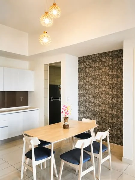 Dining features: wooden dining table, 4 white dining chairs with blue cushions, pendant light fixtures, white cabinetry, dark backsplash, ceramic tile flooring, refrigerator visible, decorative vase with flowers, wall with patterned wallpaper; style: modern. Kitchen features: white cabinetry, dark backsplash, ceramic tile flooring, refrigerator visible; style: modern.