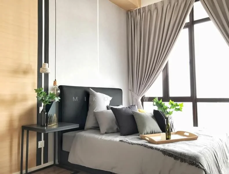 Bedroom features: king-size bed with grey bedding, upholstered headboard, decorative pillows in various colors, nightstand with a glass vase, wooden tray on bed, floor-to-ceiling windows, sheer curtains, grey accent wall, wooden flooring, pendant light fixture; style: modern; view: city.