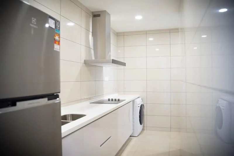 Kitchen features: stainless-steel fridge, white cabinetry, white countertop, built-in oven, 4-burner gas hob, stainless-steel range hood, ceramic tile backsplash, washing machine, recessed LED downlights, grey tiled flooring, white tiled walls; style: modern.