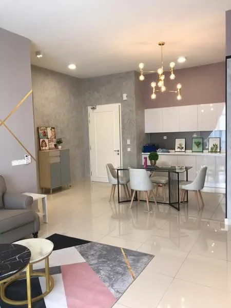 Living features: grey accent wall, white painted walls, glossy tile flooring, chandelier with multiple bulbs, 3-seater fabric sofa in light grey, coffee table with marble top, area rug with geometric pattern, dining table for 4 with black metal frame, upholstered dining chairs, kitchen cabinetry with white finish, countertop with grey backsplash, decorative plants on countertop; style: modern.