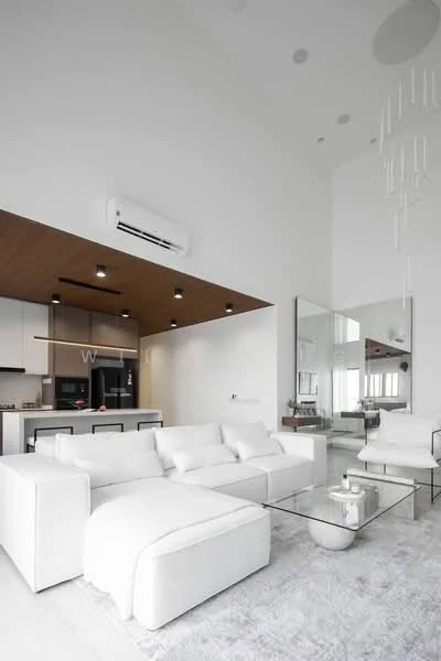 Living features: white fabric sectional sofa, glass coffee table, area rug with geometric pattern, high ceiling with recessed downlights, wall-mounted split AC, large mirror, wood paneling on ceiling, pendant light fixture, open-plan layout to kitchen; style: modern. Kitchen features: white cabinetry, black countertop, stainless-steel appliances, built-in oven, freestanding range oven, microwave, kitchen island, bar stools; style: modern.