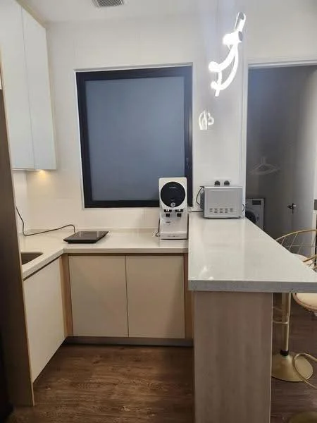 Kitchen features: single-bowl stainless-steel sink, chrome pull-down faucet, white cabinetry, light-colored countertop, bar counter with stools, built-in appliances, wooden flooring, recessed lighting, large window, neutral wall color; style: modern.