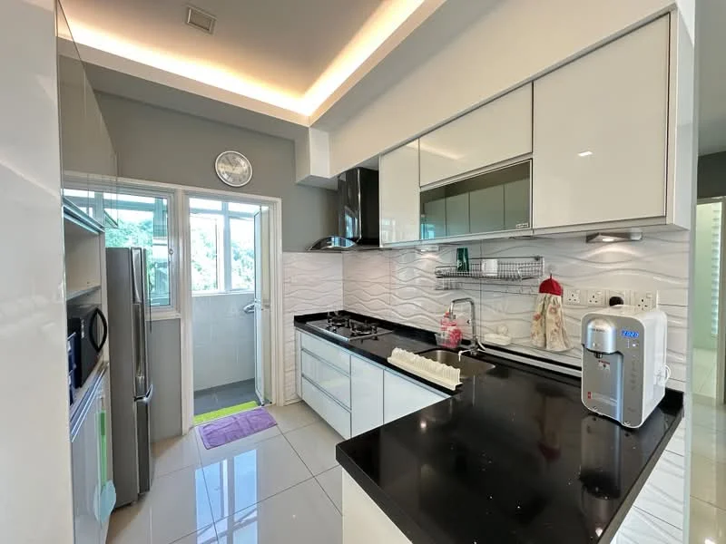 Kitchen features: black granite countertop, white high-gloss cabinetry, stainless-steel sink, chrome pull-down faucet, built-in oven, stainless-steel fridge, ceramic tile flooring, recessed LED downlights, wall-mounted kitchen shelf, white tiled backsplash with wave pattern, window with sheer curtains, kitchen island with seating, microwave, kettle; style: modern; view: garden.
