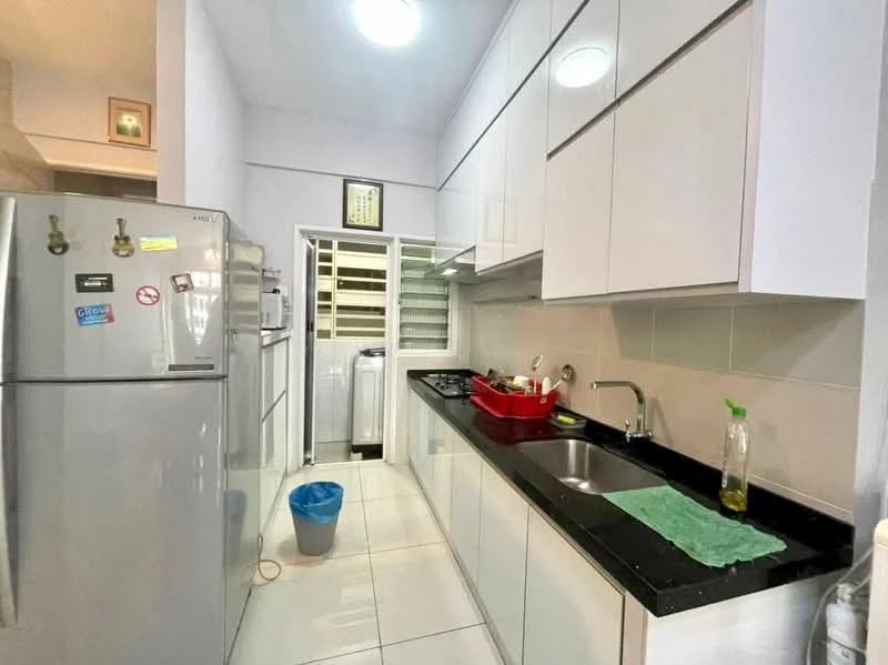 Kitchen features: white glossy cabinetry, black granite countertop, single-bowl stainless-steel sink, chrome pull-down faucet, stainless-steel fridge, built-in oven, ceramic tile flooring, recessed ceiling lights, window with sliding grille, plastic waste bin, red plastic dish rack; style: modern.
