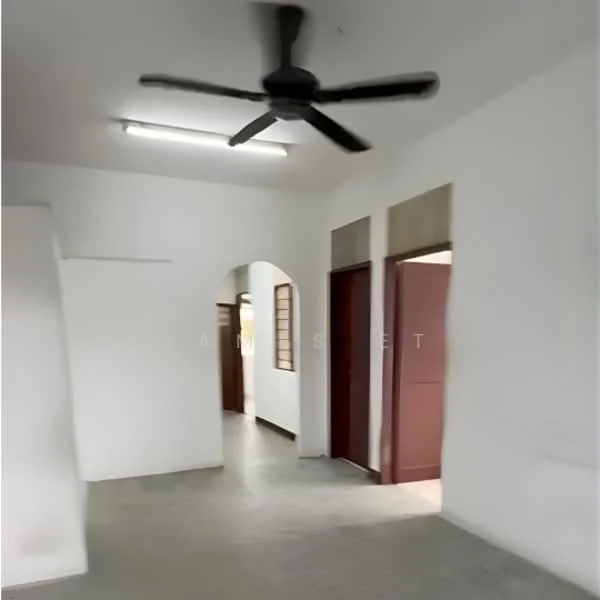 Room features: white painted walls, concrete flooring, 5-blade ceiling fan, arched doorway, two doorways leading to other rooms, fluorescent ceiling lights; style: minimalist.