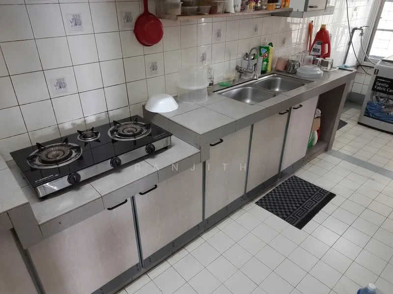 Kitchen features: double-bowl stainless-steel sink, chrome pull-down faucet, 2-burner gas hob, grey laminate cabinetry, white tiled backsplash, white tiled walls, grey tiled flooring, countertop with overhang, dish drying rack, kitchen utensils, cleaning supplies, washing machine.