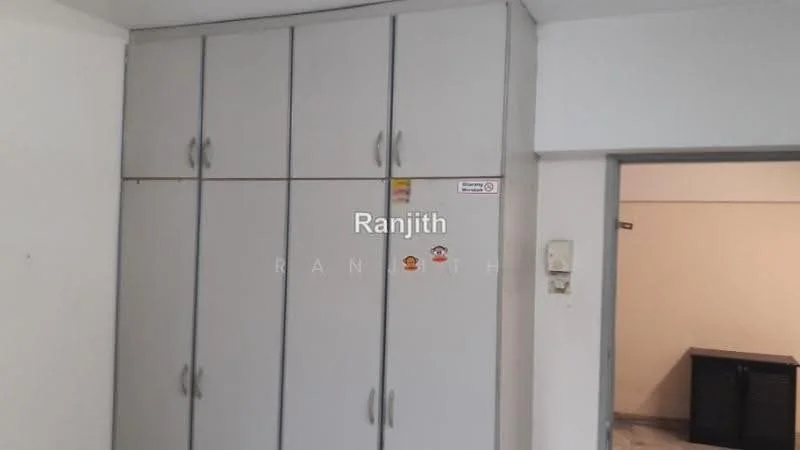 Room features: built-in wardrobe with multiple doors, grey cabinetry, neutral wall colour, tile flooring, light switch, doorway leading to another room; style: modern.