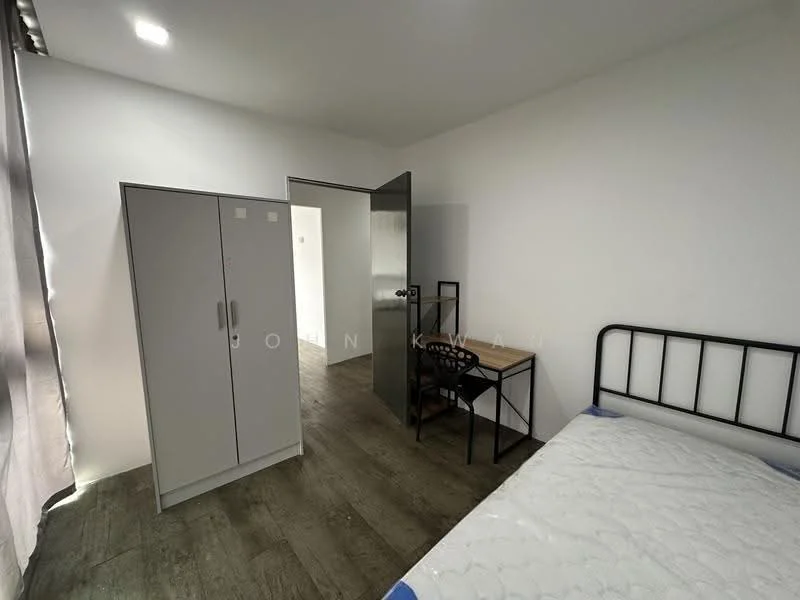 Bedroom features: white painted walls, laminate flooring, single bed with mattress, metal bed frame, grey wardrobe with sliding doors, wooden study desk, black chair, window with sheer curtains, door leading to hallway; style: minimalist.