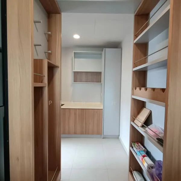 Room features: built-in cabinetry with wood finish, open shelving, white countertop, light grey walls, recessed ceiling lights, tile flooring, storage compartments, pantry area; style: modern.
