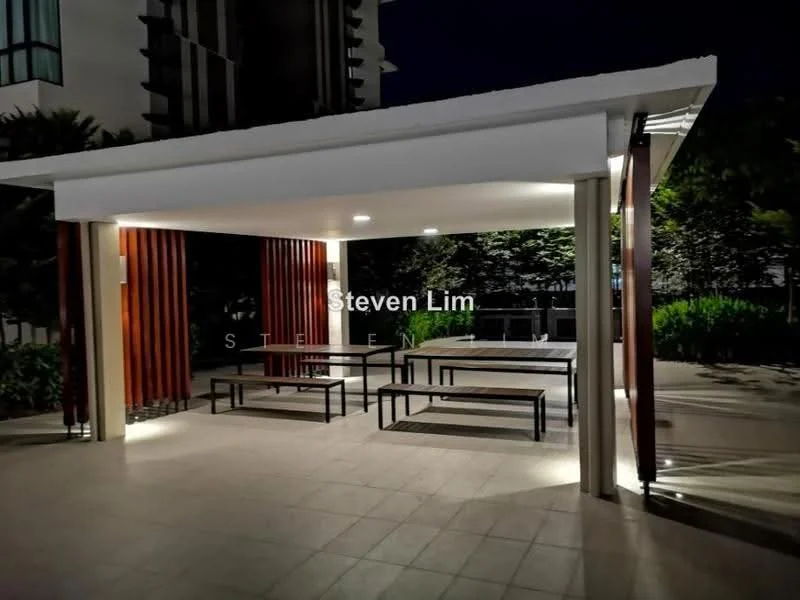 Exterior type: clubhouse; features: covered outdoor seating area, wooden slatted walls, concrete flooring, ambient lighting, multiple picnic tables, landscaped greenery in background; style: modern.