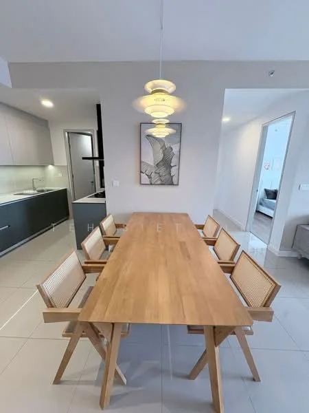 Dining features: wooden dining table, 8 wooden dining chairs, pendant light fixture, white walls, grey tiled flooring, open layout to kitchen, framed artwork on wall, natural light from adjacent room; style: modern. Kitchen features: stainless-steel sink, built-in cabinets, countertop with backsplash, kitchen appliances visible, open layout to dining area; style: modern.