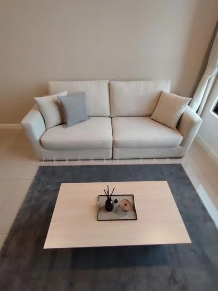 Living features: 3-seater fabric sofa in light beige, grey throw pillow, light grey throw pillow, wood coffee table, decorative tray on coffee table, candles on coffee table, area rug in dark grey, plain painted walls in light color, tile flooring in light color, floor-to-ceiling window treatments; style: modern.