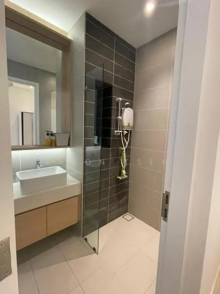 Bathroom features: grey tiled walls, white sink, wood cabinetry, glass shower enclosure, rain shower head, handheld shower, mirror above sink, white floor tiles, wall-mounted shower controls, recessed lighting; style: modern.