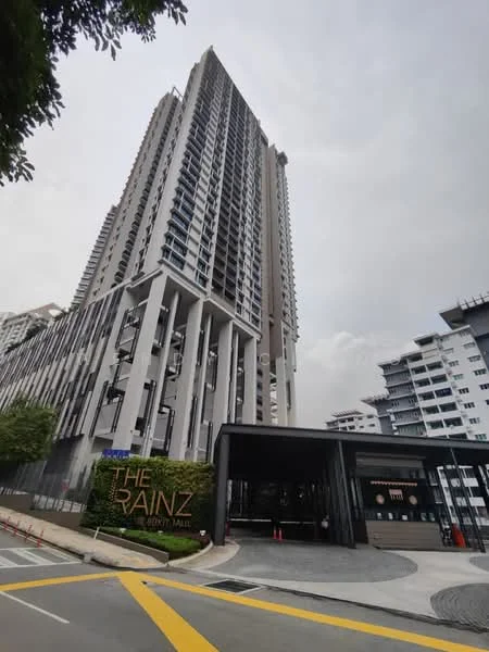 Exterior type: high-rise condominium; features: glass curtain wall, exposed concrete facade, recessed balconies, feature lighting at night, double-volume main lobby, manicured landscaping, surrounded by mature greenery, driveway with interlocking pavers; style: modern.