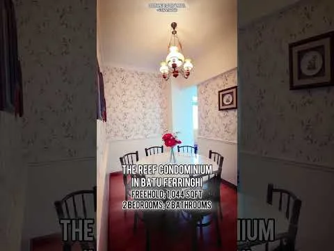 Dining features: wooden dining table, 6 dining chairs, chandelier with multiple bulbs, floral wallpaper, wooden flooring, decorative wall frames, window with curtains; style: traditional.