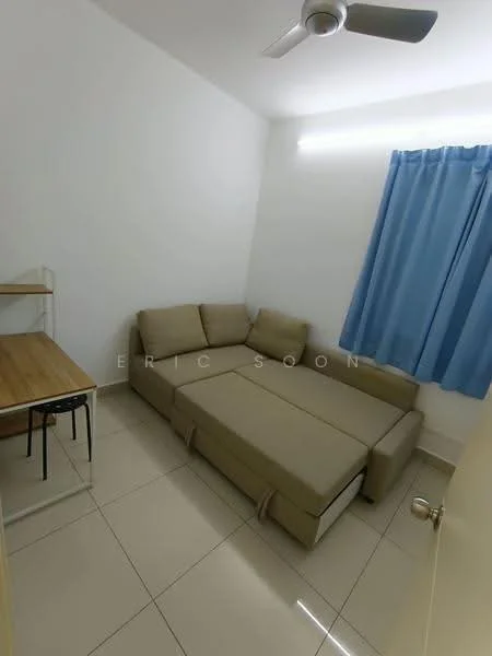 Room features: light beige sectional sofa, ceiling fan, white painted walls, blue curtain, tile flooring, wooden desk, metal legs on desk, natural light from window; style: modern.