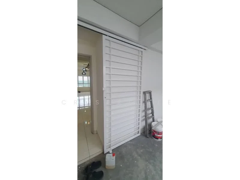 Room features: white sliding door, tile flooring, unfinished wall, ladder, paint bucket, cleaning supplies, grey concrete floor.