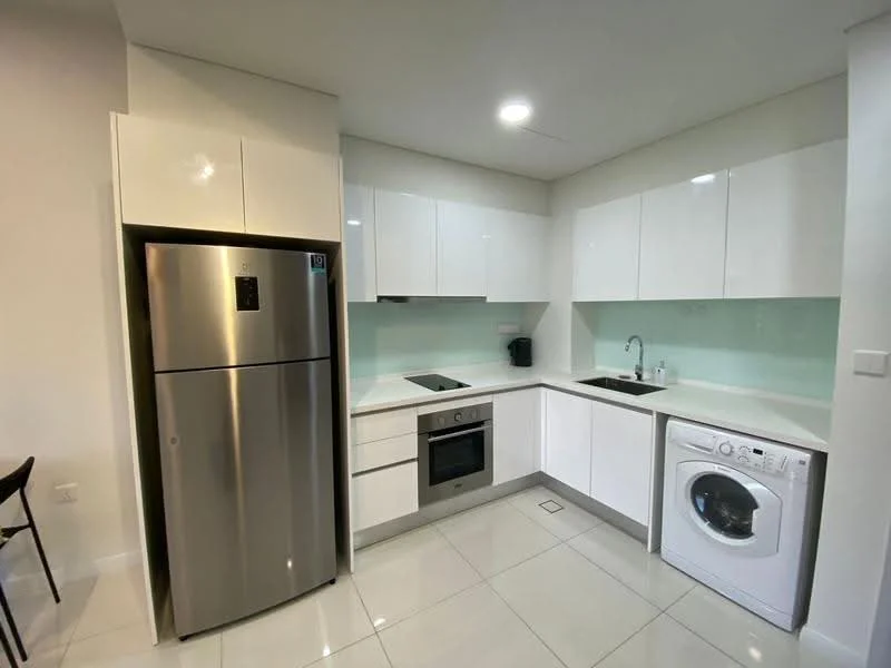 Kitchen features: stainless-steel fridge, built-in oven, 4-burner gas hob, single-bowl stainless-steel sink, chrome pull-down faucet, white glossy cabinets, white countertop, white tiled backsplash, front-load washing machine, ceramic tile flooring, recessed downlights; style: modern.