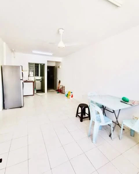 Room features: white painted walls, tile flooring, ceiling fan, dining table with chairs, stainless-steel fridge, open layout, kitchen area visible in background, plastic stools, natural light from windows; style: minimalist.