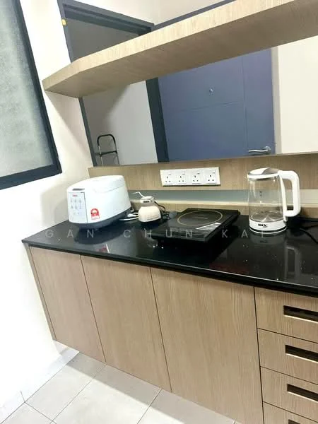 Kitchen features: wood cabinetry, black granite countertop, built-in microwave, electric kettle, single-burner induction cooktop, white rice cooker, shelf above countertop, tile flooring, grey wall, mirror backsplash; style: modern.