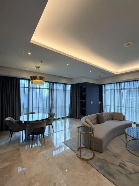 Living features: sofa with curved design in light grey fabric, round glass coffee table, marble flooring, recessed downlights, chandelier with gold accents, floor-to-ceiling windows with sheer curtains, decorative area rug with abstract pattern, built-in shelving unit, dining table with round glass top and upholstered chairs; style: modern; view: city.