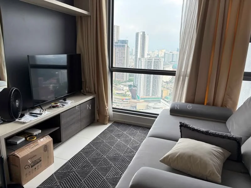 Living features: floor-to-ceiling windows, grey fabric sofa, decorative cushion, TV console, wall-mounted TV, black area rug with geometric pattern, light-colored cabinetry, curtains, fan, city skyline view; style: modern; view: city.