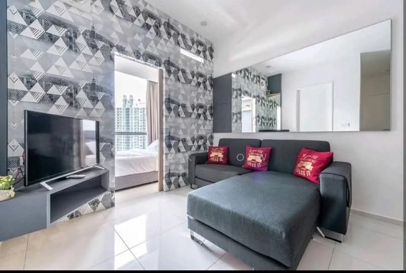 Living features: grey fabric sofa with chaise, two decorative cushions in red, wall-mounted flat-screen TV, TV console with open shelving, large mirror on the wall, geometric patterned wallpaper in grey and black, glossy white tile flooring, natural light from large window, curtains with geometric pattern; style: modern; view: city.