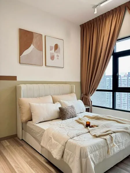 Bedroom features: king-size bed, upholstered headboard, cream bedding, decorative throw pillows, wooden bedside table, framed artwork on walls, floor-to-ceiling window, curtains in warm tones, wooden flooring, decorative candle, blanket draped over bed; style: modern; view: city.