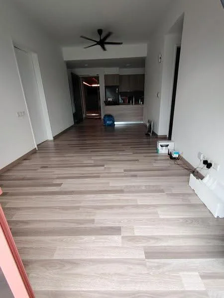 Room features: light wood laminate flooring, white painted walls, ceiling fan, open layout, recessed lighting, kitchen area visible in background, no visible furniture, large space; style: modern.