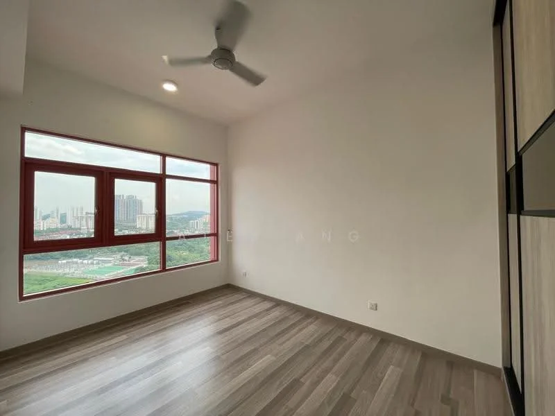 Room features: light wood laminate flooring, white painted walls, ceiling fan, large window with red frame, city skyline view, recessed ceiling lights, corner wall with built-in cabinetry, natural light from window; style: modern; view: city.