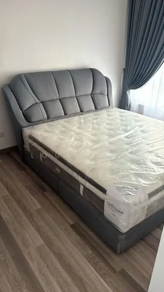 Bedroom features: king-size bed, upholstered headboard in grey, wooden flooring, floor-to-ceiling window with sheer curtains, decorative curtain drapes, bedside storage drawers, mattress with protective cover; style: modern.