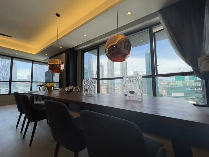 Dining features: large wooden dining table, upholstered dining chairs in grey, two pendant lamps with copper finish, floor-to-ceiling windows, city skyline view, decorative vases, fresh flowers in vase, neutral wall color, recessed ceiling lights, light-colored flooring; style: modern; view: city.