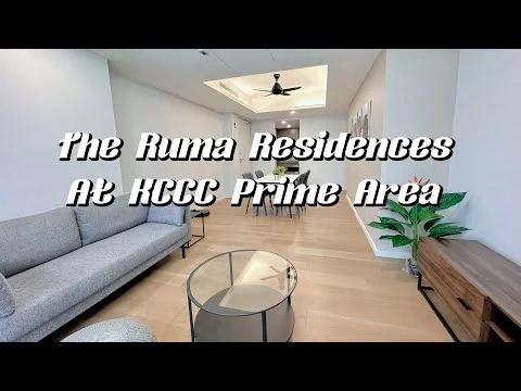 Living features: light wood flooring, white painted walls, tray ceiling with recessed lighting, 5-blade ceiling fan, large window with natural light, grey fabric sofa, glass coffee table, wooden TV console, decorative plants; style: modern.